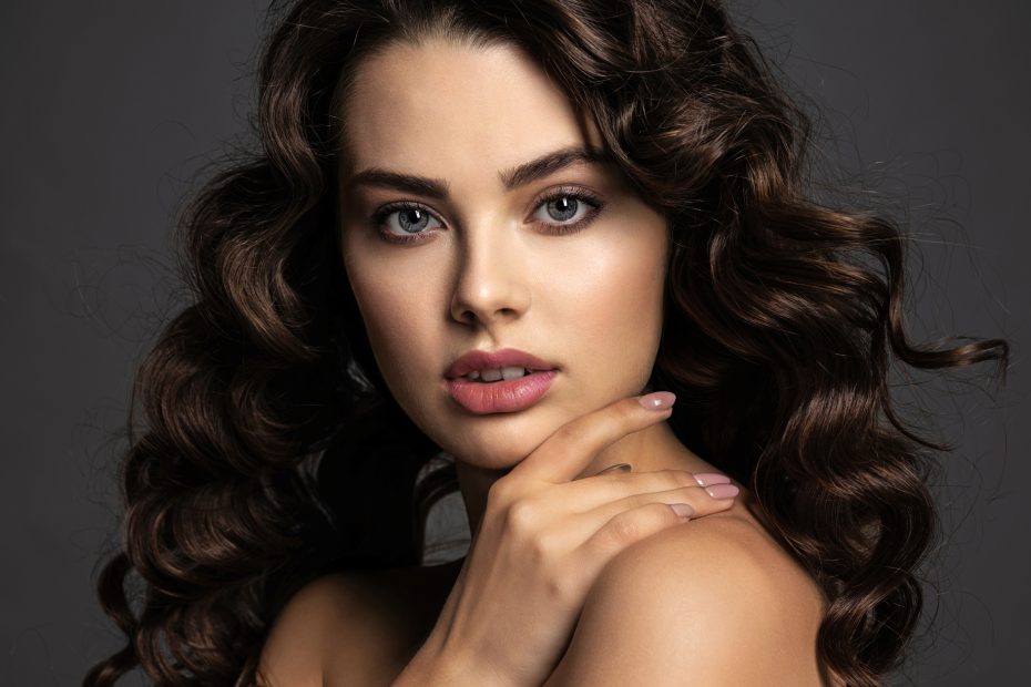 Beautiful Young Woman With Long Curly Brown Hair